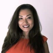 Enjoyable woman smiling at casino table, playing g.  Onyx Casino Online